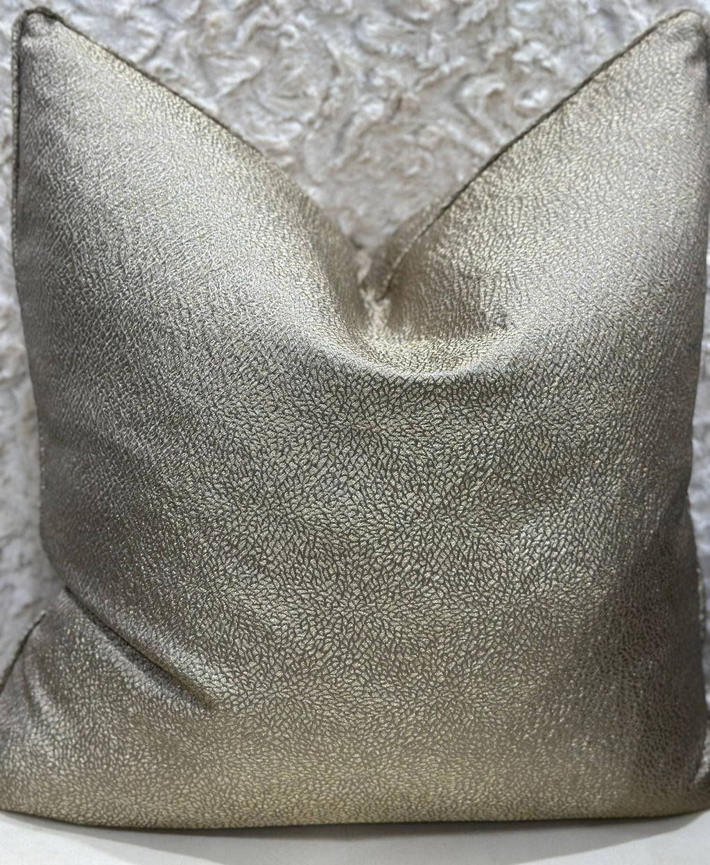 Metallic gold cushion