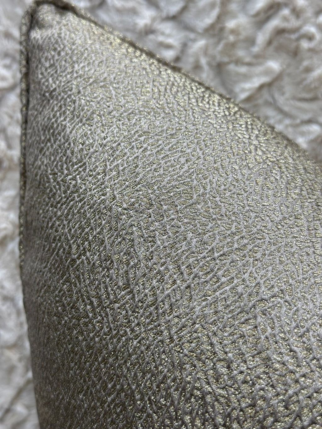 Metallic gold cushion