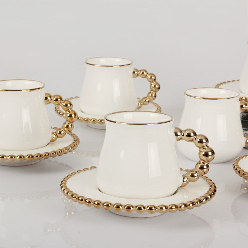 Gold beaded coffee cups