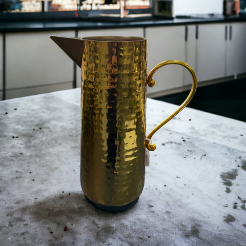 Hammered metal gold pitcher