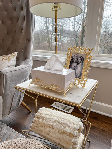 White tissue box with gold tissue holder